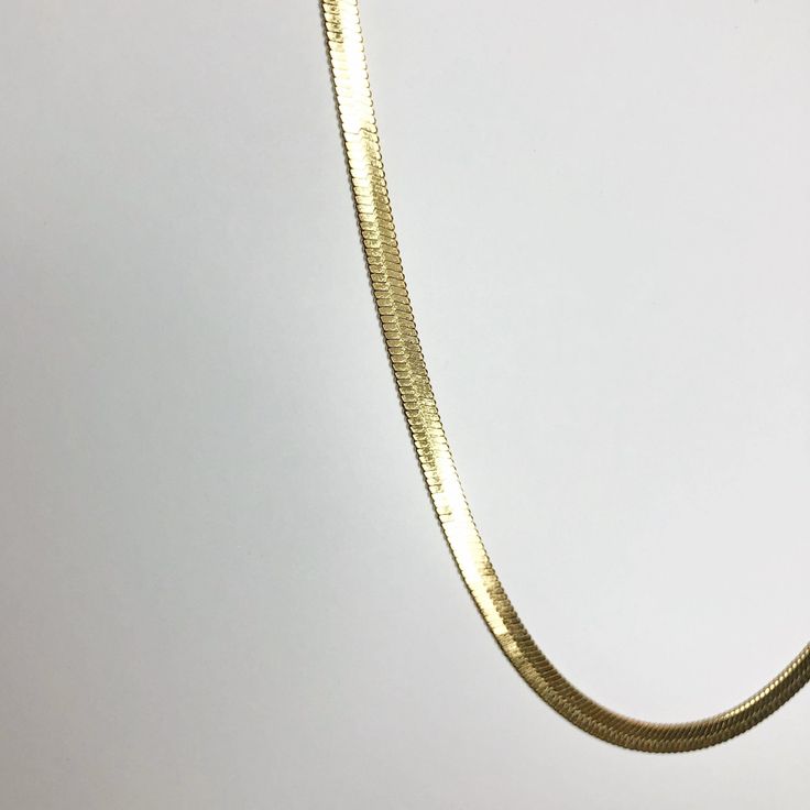 One of our favorite pieces offered at JESSA, this radiant herringbone chain is great to add to your everyday collection. Certainly will get plenty of wear without a doubt. Extremely versatile, it's a classic piece that can be dressed up or down. Stainless less; gold plated Chain is 14" long, with 3.25" extender Chain width: 4mm Gold Herringbone Necklace With Adjustable Chain, Classic Gold Link Herringbone Necklace, Gold Classic Herringbone Link Necklace, Elegant Gold Herringbone Necklace With Curb Chain, Gold Herringbone Necklace With Box Chain, Gold Herringbone Necklace With Box Chain For Everyday, Classic Gold Snake Chain Necklace For Everyday, Everyday Yellow Gold Plated Snake Chain Necklace, Gold Herringbone Necklace With Adjustable Chain For Everyday