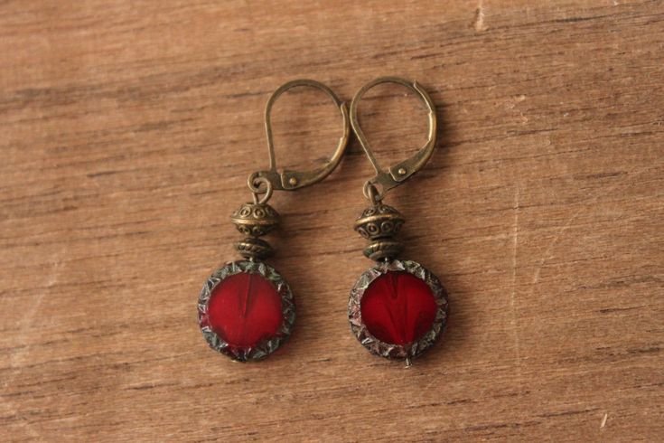 Red Earrings Czech Glass Earrings Dangle Earrings Drop Earrings SMALL EARRINGS Christmas Gift for women Color : Red Sun COINS, Picasso Czech Table Cut Glass Beads . 12 mm Finish : Antiqued copper Size : Approx 1,5 inches including the antiqued copper lever back Ear wires : Antiqued copper lever back Czech Glass Earrings : https://www.etsy.com/shop/NtikArtJewelry?ref=hdr_shop_menu&section_id=16062218 Thanks for looking Red Brass Drop Earrings, Red Round Metal Earrings, Vintage Red Single Earring, Red Brass Earrings With Ear Wire, Red Metal Drop Earrings, Vintage Red Brass Earrings, Red Dangle Earrings With Lever Back Ear Wires, Nickel-free Red Brass Earrings, Red Metal Earrings