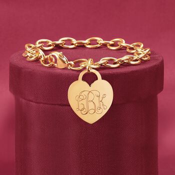 Ross-Simons - Monogram Italian 14kt Yellow Gold Heart Charm Bracelet. 8". Our classic 14kt yellow gold cable link bracelet with a heart charm is a lovely piece that dresses up any ensemble! Charm comes personalized with monogram in block or script. Made in Italy. Lobster clasp, 14kt yellow gold bracelet. Elegant Gold Charm Bracelet With Heart Charm, Classic Gold Bracelets For Valentine's Day, Elegant 14k Gold Charm Bracelet, Elegant Heart Bracelet With Charms, Elegant Gold-tone Bracelets For Valentine's Day, Elegant Gold-tone Bracelet For Valentine's Day, Classic Heart Charm Bracelet, Elegant Heart Shaped Tarnish Resistant Charm Bracelet, Classic Rose Gold Heart Bracelet For Anniversary