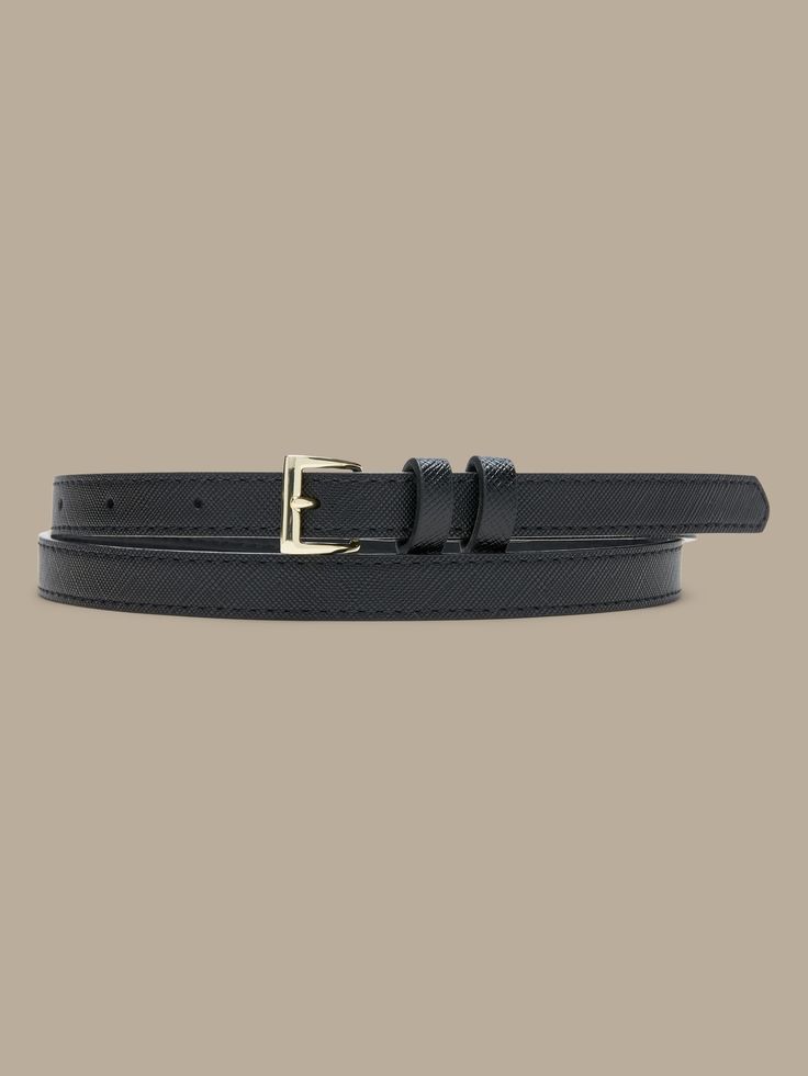 This skinny belt dresses up any outfit.  Single prong buckle. Formal Adjustable Belts With Buckle Closure, Adjustable Belt With Buckle Closure For Formal Wear, Adjustable Formal Belt With Buckle Closure, Chic Belts With Buckle Closure For Work, Chic Belts For Work With Buckle Closure, Chic Black Belt For Workwear, Trendy Black Belt With Buckle Closure, Adjustable Belt With Buckle Closure For Fall, Trendy Belts For Workwear In Fall