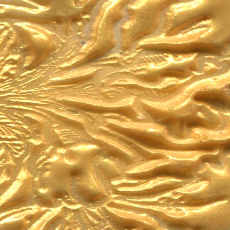 an intricately detailed gold background with swirls and leaves