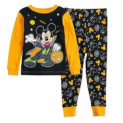 He can spend Halloween with Mickey in this spookily fun pajama set. Brightly colored graphics with Mickey in his vampire costume. Orange collar trim and long sleeves. Coordinating print pajama pants with an elasticized waistband for a custom fit. Of a 100% cotton, to be worn snug-fitting.   Paypal Payments Accepted.   All purchases are mailed out within 2 business days of receipt of payment. Black Cartoon Print Sleepwear, Winter Character Print Loungewear Sleepwear, Winter Loungewear Sleepwear With Character Print, Winter Sleepwear With Character Print, Long Sleeve Character Print Sleepwear, Black Cartoon Print Sleepwear For Sleepover, Long Sleeve Graphic Print Sleep Sets, Black Cartoon Print Sleepwear For Pajama Party, Long Sleeve Graphic Print Bedtime Set