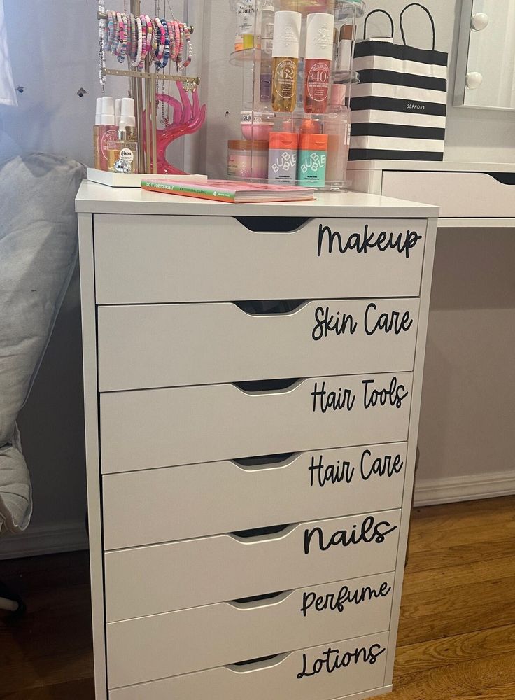 a white dresser with lots of makeup products on it's top drawer and the words make up, skin care, hair tools, nail care, nails, peopee