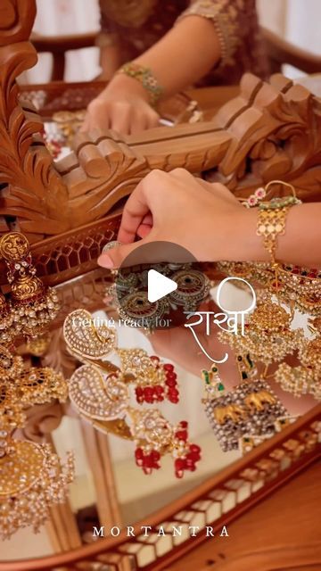 the woman is working on her jewelry at the table