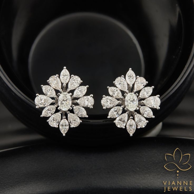 Experience the epitome of elegance with our 6.41 total carat weight earrings, masterfully crafted with lab-grown diamonds. Featuring a harmonious blend of three timeless cuts - the classic oval, the slender marquise, and the graceful pear, these earrings embody both modern innovation and ageless sophistication. Set in a design that accentuates each unique shape, they offer brilliant sparkle and unparalleled beauty. An eco-friendly choice, our lab-grown diamonds promise the same brilliance as mined diamonds but with a more sustainable footprint. These earrings are not just a piece of jewelry, but a statement of style and ethics, perfect for any discerning jewelry aficionado. 💎 EARRING Features: → Shape: OVAL CUT,MARQUISE CUT, PEAR CUT → Carat: 6.41 TCW → Color: G+ → Clarity: VS+ As the lis Luxury Oval Gia Certified Earrings, Elegant Gia Certified Oval Diamond Earrings, Luxury Oval Diamond Earrings For Anniversary, Luxury Diamond White Cluster Earrings For Wedding, Luxury Marquise Cut Cluster Earrings For Formal Occasions, Luxury Oval Bridal Earrings For Formal Occasions, Luxury Halo Design Cluster Earrings For Wedding, Luxury Wedding Cluster Earrings With Halo Design, Luxury Oval Bridal Earrings With Prong Setting