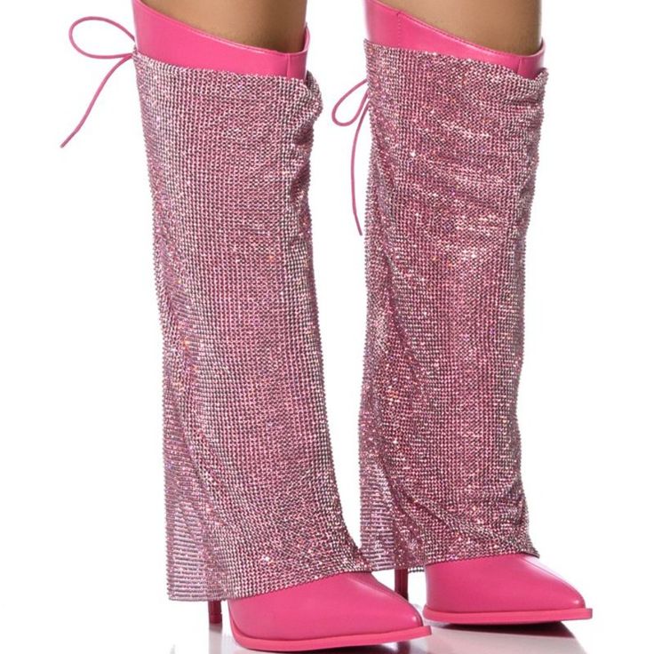 The Azalea Wang " Take Cover " Embellished Stiletto Boot In Fuchsia Is An Enticing, Glimmering Below-The-Knee Pair Featuring A Faux Leather Base And A Rhinestone Chainmail Covered Shaft With A Back Lace-Up Detail. Complete With A Pointed Toe, A Slightly Covered Slim Stiletto Heel, And Side Zipper Closure. Pair With Mini Dresses And Mini Bags For An Extra Edge. - All Man-Made Materials - Pu Upper - Pointed Toe - Inner Zipper Closure - Pointed Toe - Stiletto Heel - 12” Shaft - 4.5” Heel - 15" Calf Pink Boots For Night Out During Party Season, Chic Pink Party Boots, Pink Pointed Toe Boots For Party Season, Embellished Pink High Heel Boots, Pink Embellished High Heel Boots, Embellished Pink Boots For Evening, Embellished Pink Evening Boots, Pink Rhinestone Heels For Cocktail, Glamorous Pink Heels With Sequins