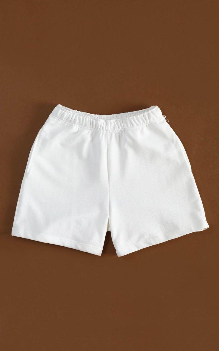 Cozy and consciously made, our 100% Organic Traceable Cotton Sweatshorts are the perfect intersection of sustainability and street style. LEARN MORE → certified organic fibre→ free from toxic substances like bleach & formaldehyde→ colored with nontoxic dyes→ water and energy are monitored→ manufactured in safe working conditions MeasurementsSizes: XS, S, M, L, XL, XXLColor: Off-white SIZE CHART White Solid Color Shorts, Basic Cotton Shorts For Summer, Basic White Cotton Shorts, Basic White Bottoms With Built-in Shorts, Casual White Solid Color Shorts, Sporty Solid Color Short Length Shorts, Sporty Solid Color Short-length Shorts, Basic Cotton Athletic Shorts For Summer, White Solid Color Shorts For Spring