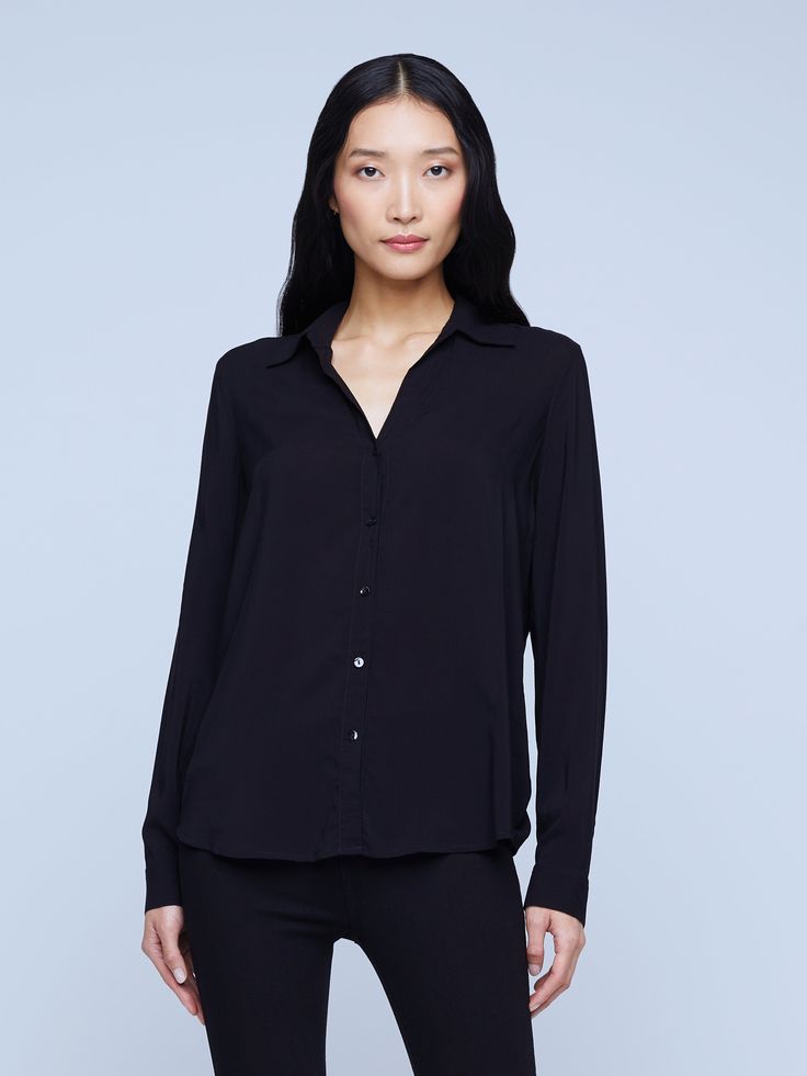 A modern classic. The Nina blouse is structured in all the right places with a relaxed, flattering fit. Refined button-down construction with a chic open collar and draped long sleeve in black silk. Timeless Spread Collar Blouse For Work, Chic Blouse With Hidden Button Closure For Work, Timeless Office Blouse With Lapel Collar, Sleek Spread Collar Blouse For Work, Sleek Blouse With Spread Collar For Work, Timeless Collared Blouse For Work, Timeless Business Casual Blouse With Spread Collar, Timeless Blouse With Fold Down Collar For Work, Chic Business Casual Blouse With Lapel Collar