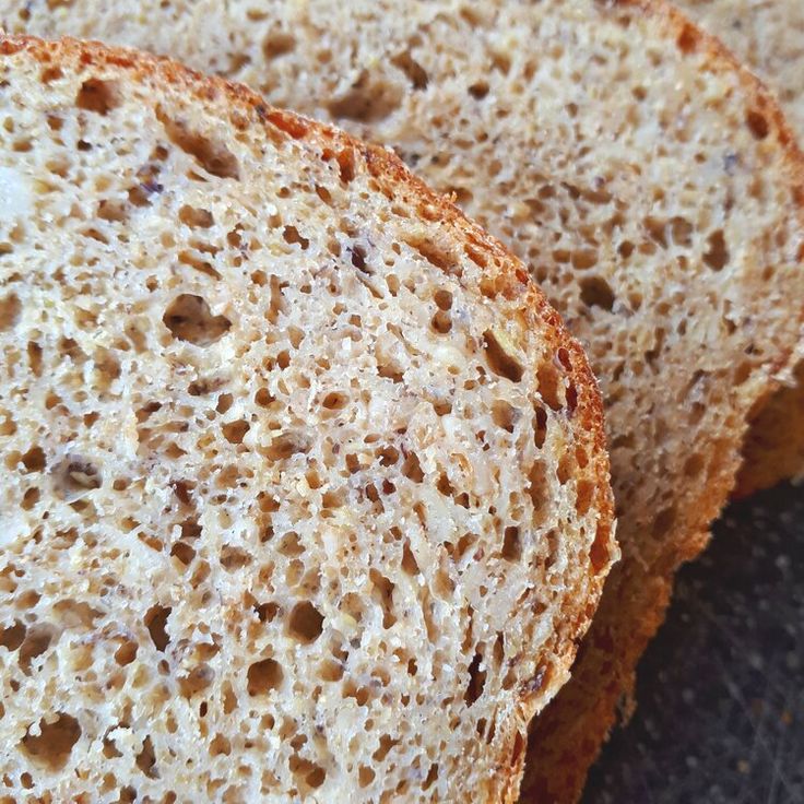 two pieces of bread sitting on top of a black countertop next to each other