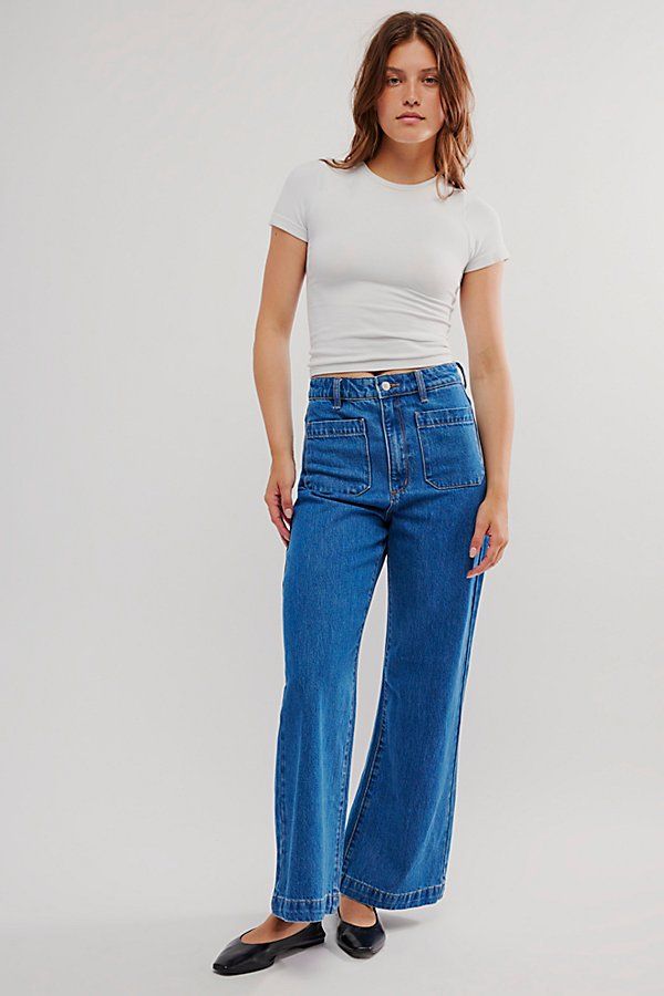 High-waisted jeans featured in a wide-leg silhouette. * Authentic denim * Front and back patch pockets * Button closure and zip fly | Rolla’s Sailor Jeans by Rolla's at Free People in Medium Wash, Size: 32 Spring Dark Wash Flare Jeans With Patch Pockets, Spring Flare Jeans With Patch Pockets In Dark Wash, Wide Leg Cotton Flare Jeans With Patch Pockets, Casual High Rise Flare Jeans With Contrast Stitching, High Rise Flare Jeans With Patch Pockets, Casual Flare Jeans With Patch Pockets, Casual Wide-leg Flare Jeans With Patch Pockets, Denim Wide Leg Pants With Patch Pockets, Wide Leg Bottoms With Contrast Stitching In Medium Wash