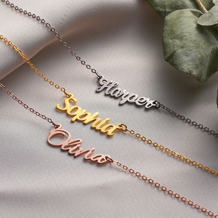 Welcome to MeiraGoldJewelry, where we create exquisite name necklaces to commemorate life's most precious moments. Our personalized name necklaces are the perfect choice for adorning your neck on occasions such as Christmas 🎄, New Year 🎉, Valentine's Day 💖, Mother's Day 🌹, Women's Day, Thanksgiving, Anniversaries 🥂, Weddings 💍, Birthdays 🎂, and more. These pieces are meticulously crafted to bring an elegant touch to your celebrations, transforming them into unforgettable memories that wil Delicate Custom Name Necklace For Personalized Gift, Delicate Custom Name Necklace As Personalized Gift, Delicate Personalized Charm Necklaces For Gifts, Customizable Rose Gold Name Necklace For Anniversary, Delicate Personalized Charm Necklace, Delicate Name Necklace For Personalized Gift, Minimalist Name Charm Necklace For Personalized Gift, Minimalist Name Charm Necklaces For Personalized Gift, Customized Minimalist Charm Necklace For Mom