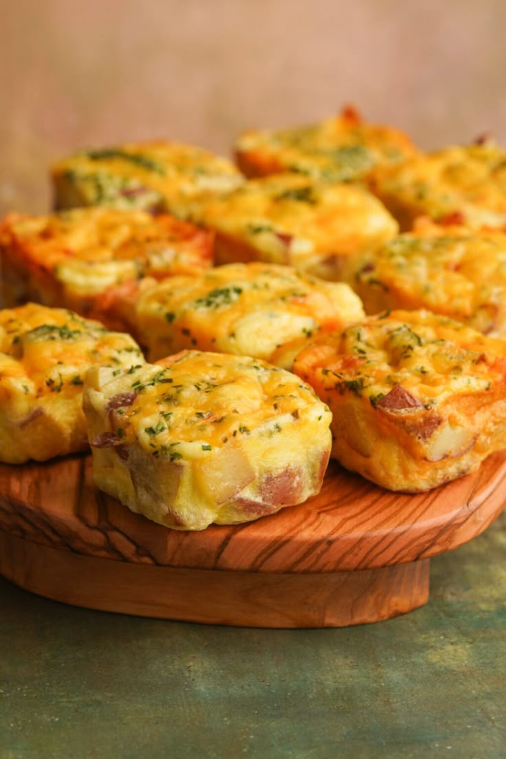 small muffins with cheese and herbs on a wooden platter