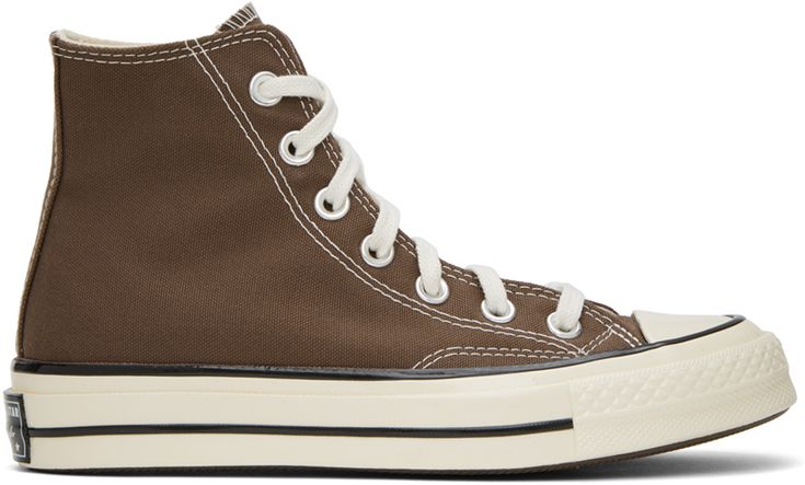 High-top canvas sneakers in brown. · Rubber cap toe · Lace-up closure · Eyelets and logo patch at inner side · Padded Ortholite™ footbed · Rubberized logo patch at heel · Treaded rubber sole · Contrast stitching in white Supplier color: Squirrel friend/Egret/Black Brown Chuck 70, Converse Brown, Women's Converse, Chuck 70, Converse Sneakers, Sportswear Women, Sneaker Collection, Converse High Tops, Womens Converse