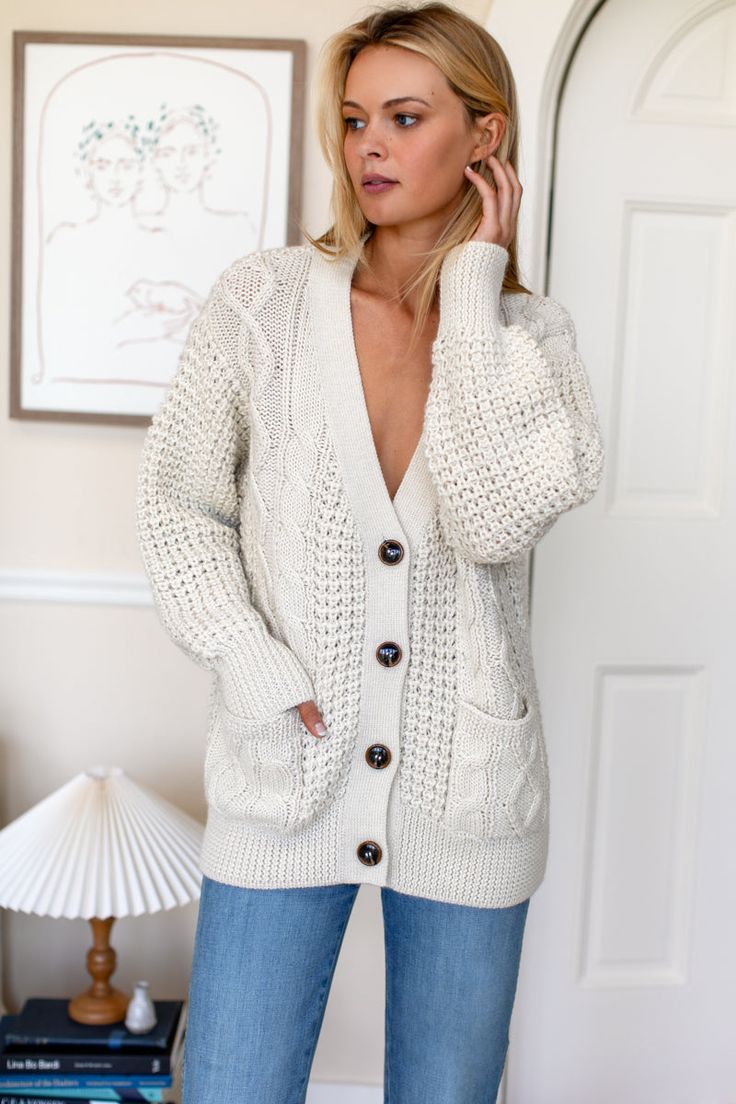 A luxe heirloom quality cardigan in the perfect, wear forever silhouette. Incredibly soft medium weight knit, jacket alternative, cozy layering. 100% super soft, extra fine alpaca Drop shoulder Patch pockets Model is wearing a size Small Dry clean Made in Peru XS: Bust 41”, Center back length 24 1/2"S: Bust 43”, Center back length 25"M: Bust 45”, Center back length 25 1/2"L: Bust 47”, Center back length 26" Soft Knit V-neck Outerwear, Winter White V-neck Outerwear For Layering, Cream Knit V-neck Outerwear, Chunky Knit Sweater For Everyday Fall Wear, Everyday Chunky Knit Fall Sweater, Cream V-neck Outerwear With Pockets, Cashmere V-neck Outerwear For Fall, Everyday Chunky Knit Sweater For Fall, V-neck Cable Knit Outerwear For Layering