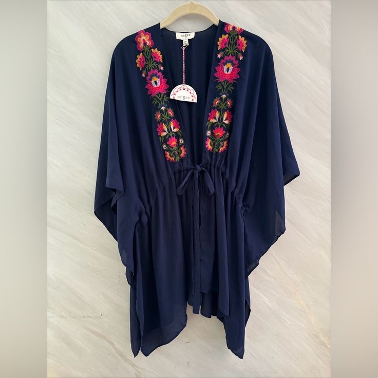 Elevate Your Wardrobe With This Stunning Umgee Kimono Cardigan Cover-Up. The Beautiful Blue Floral Pattern Is Complemented By Intricate Embroidery, Adding A Touch Of Elegance To Any Outfit. The Tie Closure Allows For A Customizable Fit And Easy Wear, While The M/L Size Is Perfect For A Comfortable And Relaxed Fit. This Blouse Is A Must-Have For Any Fashion-Forward Woman, And Its Versatile Style Makes It Suitable For Any Occasion. N66 654 Embroidered V-neck Kimono For Spring, Spring Folk Kimono With Floral Embroidery, Embroidered Multicolor Kimono For Summer, Summer Kimono With Multicolor Floral Embroidery, Summer Folk Style Embroidered Kimono, Summer Embroidered Folk Kimono, Floral Embroidered V-neck Kimono For Summer, Embroidered Folk Kimono For Summer, V-neck Floral Embroidered Kimono For Summer