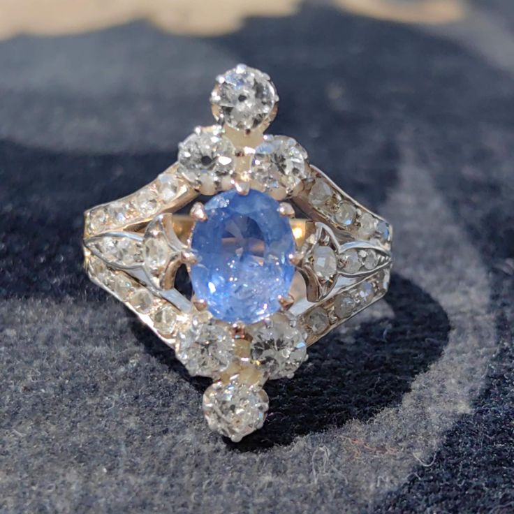 RING SIZE: US 7 1/2 EU 55.5 18k Solid Gold WEIGHT: 4.80 grams TOTAL DIAMOND WEIGHT: 0.90ct CUT: Old European COLOR: I -J CLARITY: Si1/2 GEM : Natural not treated Corn flower colour transparent Sapphire, approx 1ct weight.  CONDITION: EXCELLENT Hallmarks:  Austrian-Hungarian Monarchy from 1867 to 1922.  This is an original 1900s gold diamond and sapphire Art Nouveau ring that exudes elegance and sophistication. The ring features a stunning sapphire in the center, surrounded by sparkling diamonds that accentuate its deep blue hue. The gold band has an intricate Art Nouveau design that adds charm and character to this vintage piece. This ring is a rare and exquisite find for anyone who appreciates the beauty and craftsmanship of the past  Your item will be carefully packaged and shipped insur Victorian Sapphire Ring With Oval Brilliant Cut, Blue Diamond Ring With Rose Cut Style, Antique Blue Oval Diamond Ring, Heirloom Blue Sapphire Ring With Rose Cut Diamonds, Blue Cluster Ring With Rose Cut Diamonds, Antique Blue Brilliant Cut Ring, Antique Blue Rings With Brilliant Cut, Heirloom Blue Cluster Ring With Rose Cut Diamonds, Vintage Blue Brilliant Cut Cluster Ring