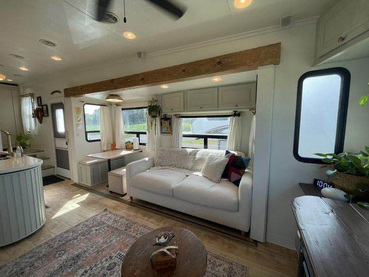 a living room and kitchen area in a mobile home