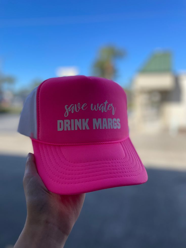 Stay cool and hydrated this summer with our Save Water Drink Margs Puff Hat in Neon Pink. Perfect for a day at the beach, this playful puff hat adds a touch of fun to your outfit while reminding you to stay hydrated. Cheers to summer! Save Water Drink, Water Drink, Keep Cool, Day At The Beach, Save Water, Stay Hydrated, Stay Cool, Drinking Water, Neon Pink