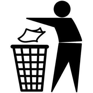 a man throwing paper into a trash can