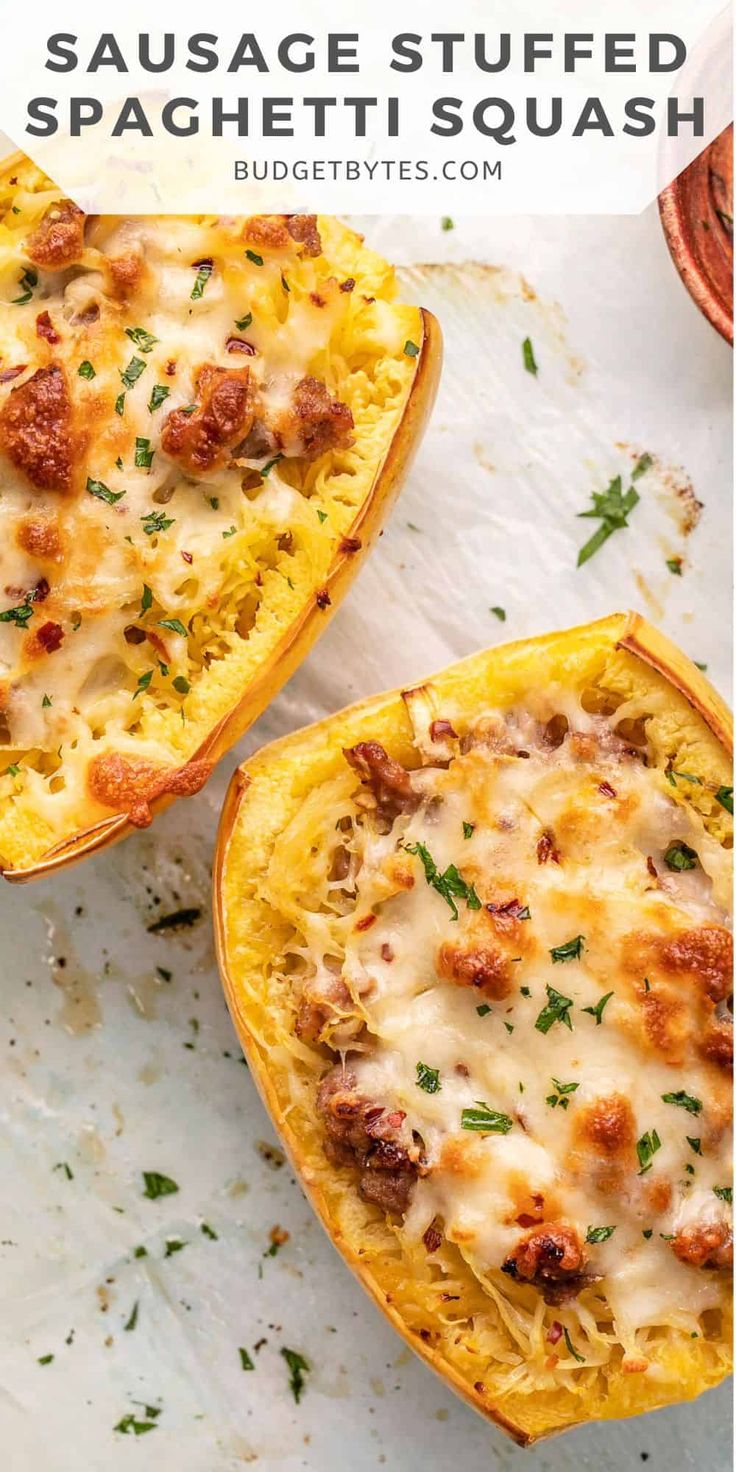 two spaghetti dish stuffed squash halves on a white surface with text overlay that reads sausage stuffed spaghetti squash