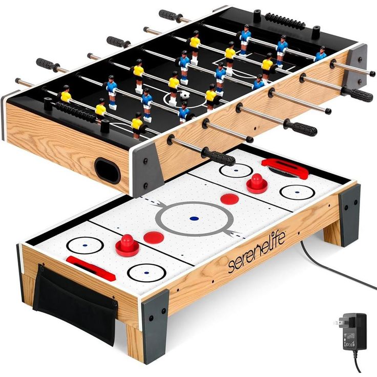 two foosball tables that are connected to each other and one has an electronic game controller