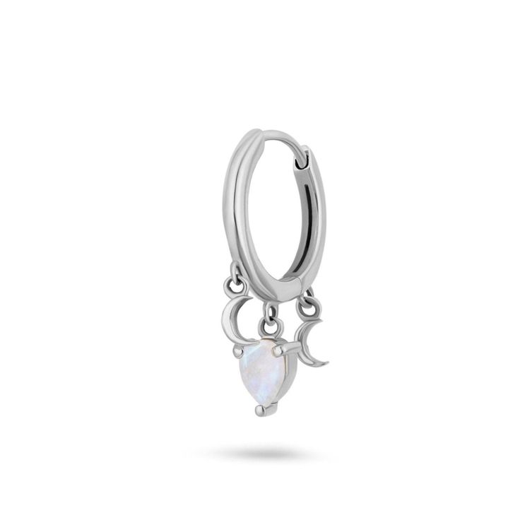 Illuminate your ear with our Moonstone Celestial Huggie Hoop Earring in sterling silver. This enchanting piece features a stunning moonstone at its centre, accented by delicate chains and celestial-inspired touches. Let your style shine!  Sold as a single This metal loves being worn everyday. It does naturally tarnish over time especially when not worn. This is easily corrected with a sterling silver polishing cloth as well as with warm soapy water and a soft non-abrasive cloth. If wearing every Silver Crescent Cartilage Earrings With Moon Charm, Sterling Silver Crescent Cartilage Earrings With Moon Charm, Minimalist Sterling Silver Hoop Earrings With Moon Charm, Sterling Silver Crescent Cartilage Single Earring, Hypoallergenic Sterling Silver Crescent Jewelry, Hypoallergenic Crescent Sterling Silver Jewelry, Ethereal Silver Moonstone Jewelry, Silver Hoop Earrings With Moon Charm, Silver Sterling Hoop Earrings With Moon Charm