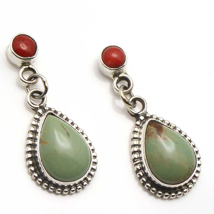 "Natural green turquoise and coral are highlighted with this pair of dangle earrings by Navajo artist Jan Mariana. Earrings are 1 3/8' long, 1/2"" wide and weigh approximately 7 grams. There will be slight variation in color and matrix from one pair to the next." Handmade Southwestern Green Earrings, Southwestern Green Dangle Earrings, Southwestern Green Sterling Silver Earrings, Southwestern Green Teardrop Earrings, Turquoise And Coral, Coral Turquoise, Green Turquoise, Matrix, Dangle Earrings