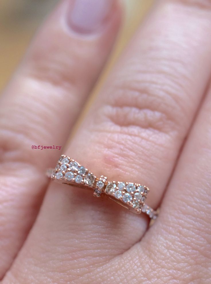 Metal: 14K Rose Gold Weight: 2.5 grams Stone Type: Diamonds Stone Shape: Round Diamond Weight: .32 Carats Size: 7 Sizing: This ring can for sure be sized up to 2 sizes up or down. Beyond that we might need to custom make the ring to your size. It can be made at any size. Please state size in size box, or contact us if needed. Customization: This ring can be custom made with any gems and metals of your choice. Please inquire. Design Element: Bow Matching Necklace: https://www.etsy.com/listing/205 Formal Pink Gold Diamond Ring With Accents, 14k Rose Gold Round Diamond Ring, Rose Gold Sterling Silver Diamond Ring With Brilliant Cut, Luxury 14k Rose Gold Brilliant Cut Jewelry, Luxury 14k Rose Gold Jewelry In Diamond White, Rose Gold 14k Round Diamond Ring, Formal Pink Gold Rings With Brilliant Cut, 14k Rose Gold Diamond Ring For Formal Occasions, Luxury 14k Rose Gold Jewelry With Prong Setting