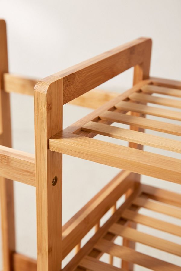 a close up of a wooden chair with slats