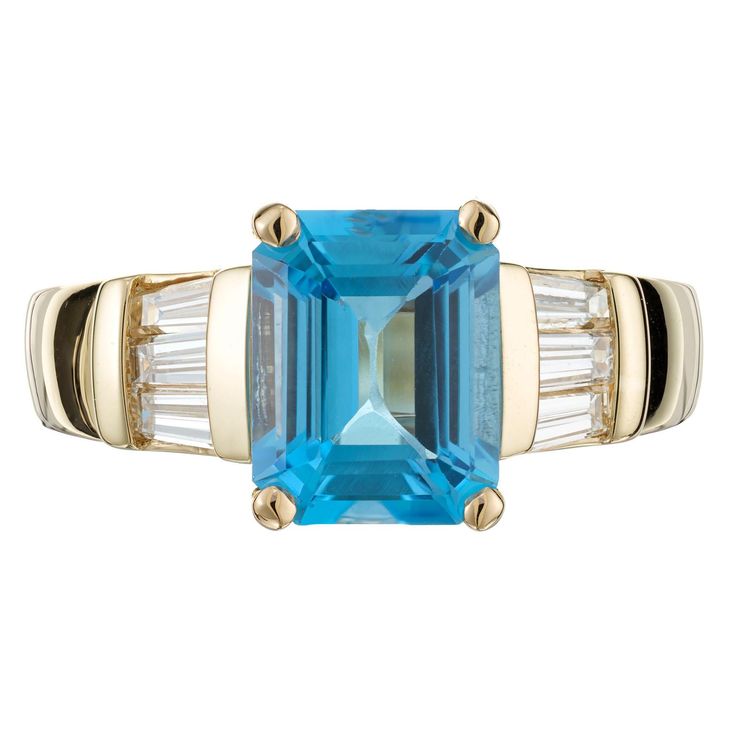 Topaz and diamond right. Bright blue emerald cut 2.50 carat topaz center stone set in a 14k yellow gold setting accented with tapered baguette diamonds. 1 rectangular blue topaz, VS approx. 2.58cts 6 tapered baguettes, H VS approx. .40cts Size 7 and sizable 14k yellow gold Width at top: 9.5mm Height at top: 6.5mm Width at bottom: 3.1mm Antique Wedding Bands, Diamond Sapphire Engagement Ring, Blue Emerald, Antique Engagement Rings Vintage, Antique Bracelets, Vintage Sapphire, Diamond Engagement Rings Vintage, Baguette Diamonds, Yellow Gold Setting