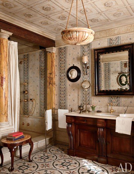 a bathroom with an antique sink and mirror