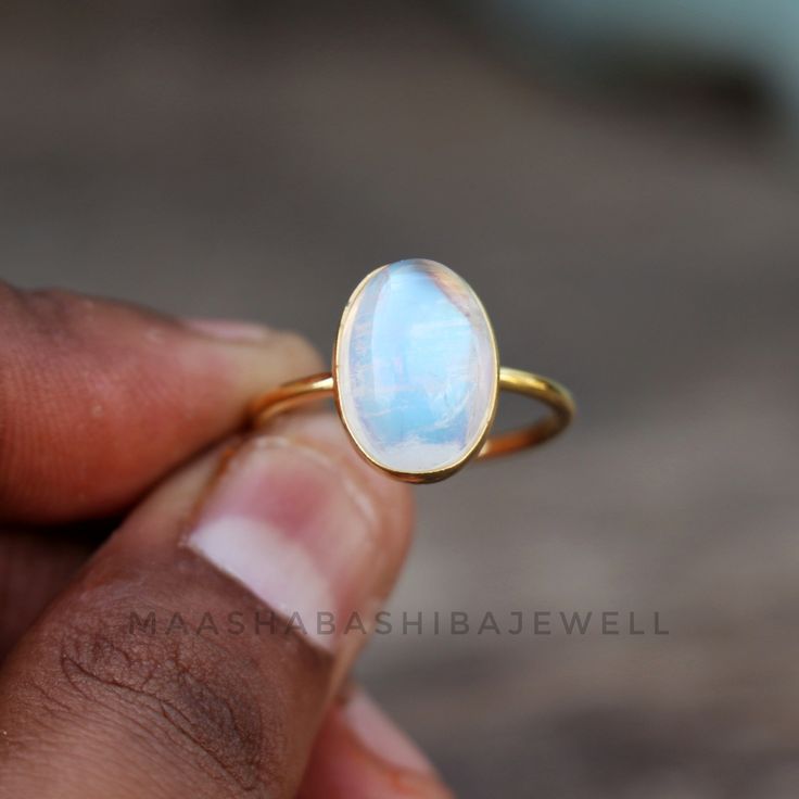 Natural Moonstone Ring, Solitaire Engagement Ring, 18k Gold Vermeil Ring, Birthstone Ring, Rainbow Moonstone Ring, Dainty Weeding Women Ring SHOP LINK:- https://www.etsy.com/shop/MaaShabashibaJewell?ref=seller-platform-mcnav 》D E T A I L S《 Gemstone: Natural Rainbow Moonstone Gem Color: Blue Stone Shape: Oval Metal: 925 Sterling Silver Purity: 925 Parts Per 1000 Setting Type: Bezel Set Silver Polish: High Ring Size: All Size Available Please note that there Can be slight variations in stone text Luxury Gift Moonstone Open Ring, Celestial Wedding Ring With Bezel Setting, Delicate White Moonstone Gemstone Ring, Delicate White Gemstone Rings, Delicate White Moonstone Ring, Elegant Handmade Stackable Moonstone Rings, Elegant Handmade Moonstone Stackable Rings, Yellow Gold Moonstone Cabochon Ring For Wedding, Handmade Elegant Moonstone Stackable Rings