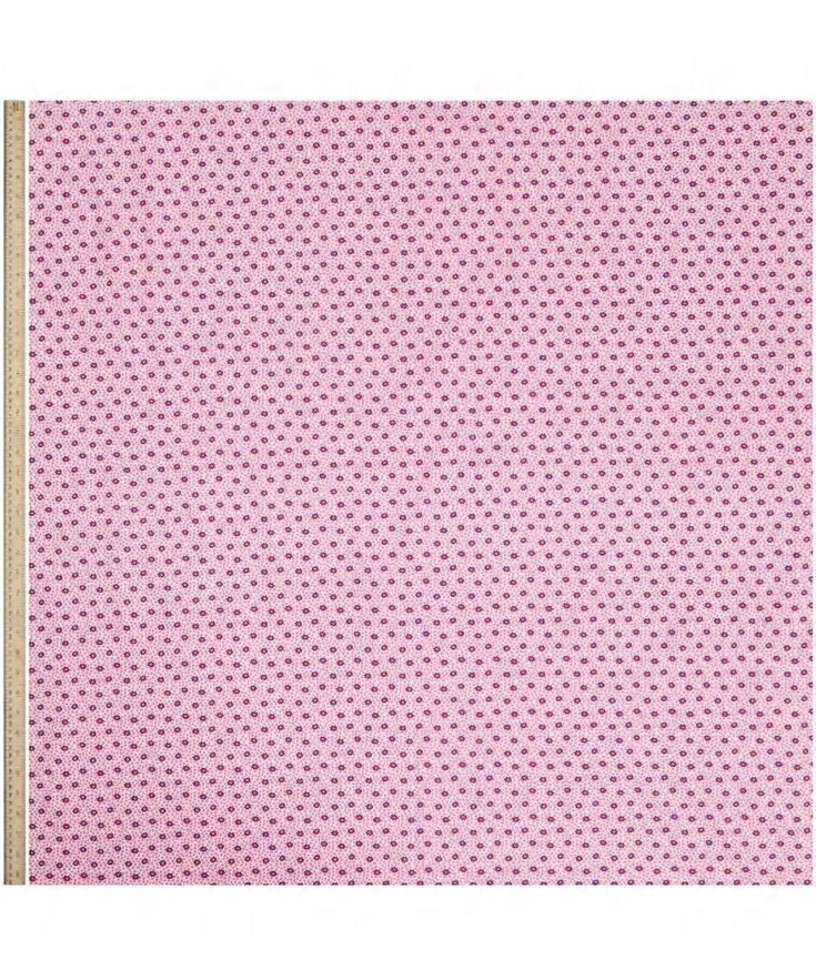 a pink background with small white dots on the bottom and gold trimming around it