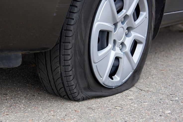 the front tire of a car with flat tires