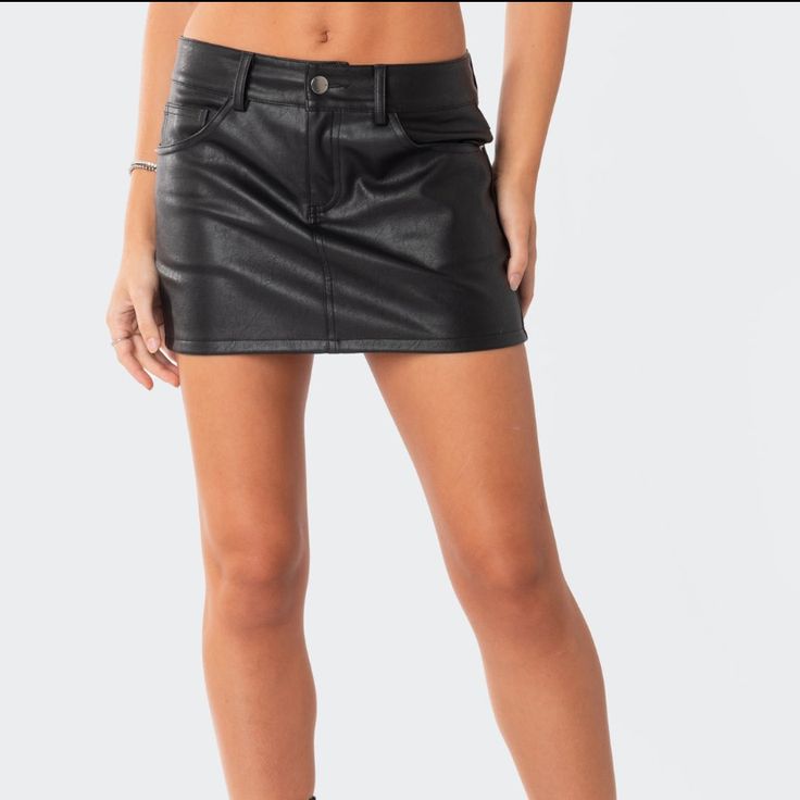 Faux Leather Mini Skirt Edgy Faux Leather Skirt For Club, Rock Style Mini Skirt For Fall Night Out, Rock Style Mini Skirt For Night Out In Fall, Fall Rock Style Mini Skirt For Night Out, Black Faux Leather Mini Bottoms, Black Leather Mini Bottoms, Faux Leather Skirt For Club In Fall, Fall Faux Leather Club Skirt, Trendy Leather Mini Skirt