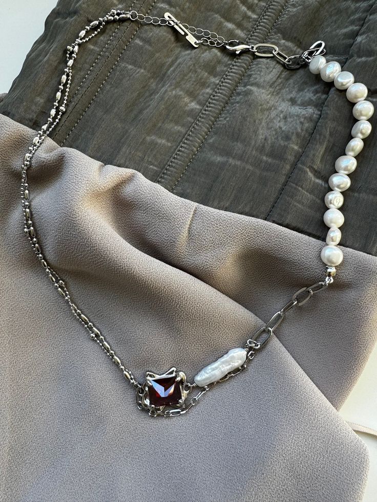 Necklace with baroque pearl and ruby crystal.   Materials: pearls, ruby crystal, sterling silver S925, rhodium plated *. Length: 41+5cm. Weight: 12.4g.   Winter sea, cold gusty wind, fishing nets, and also history and strong ties - that's what collection Aon is about.      * Why do we used rhodium? It has highly reflective quality that does not tarnish. Rhodium is allergy-friendly, harder than gold, and extremely durable. Gift set includes: 1. Sterling silver 925 jewelry. 2. Natural gemstone bra Gift Sets For Her, Tie Necklace, Ruby Crystal, Wedding Jewellery Necklace, 925 Jewelry, Baroque Pearls, Wedding Necklace, Sterling Silver Necklace, Gemstone Bracelet