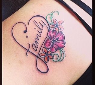 a woman with a tattoo on her stomach that says, i love my family and has flowers in the shape of a heart