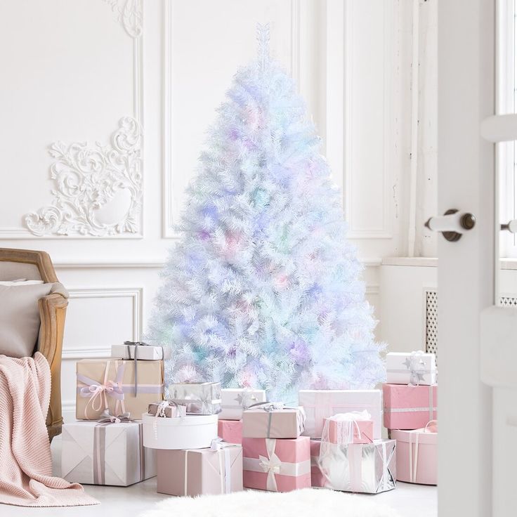 a white christmas tree surrounded by presents in pastel colors and pink, blue, and purple