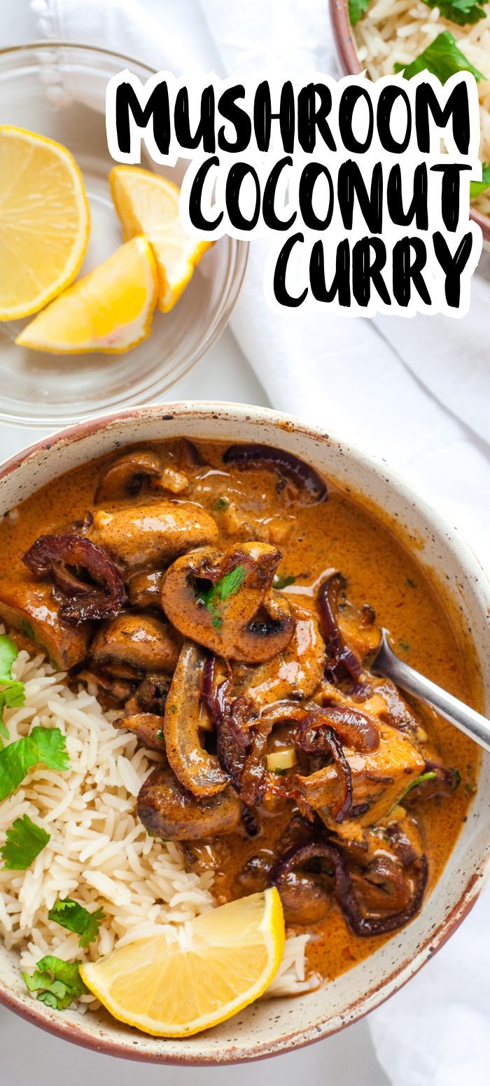 mushroom coconut curry in a bowl with rice and lemon wedges on the side for garnish