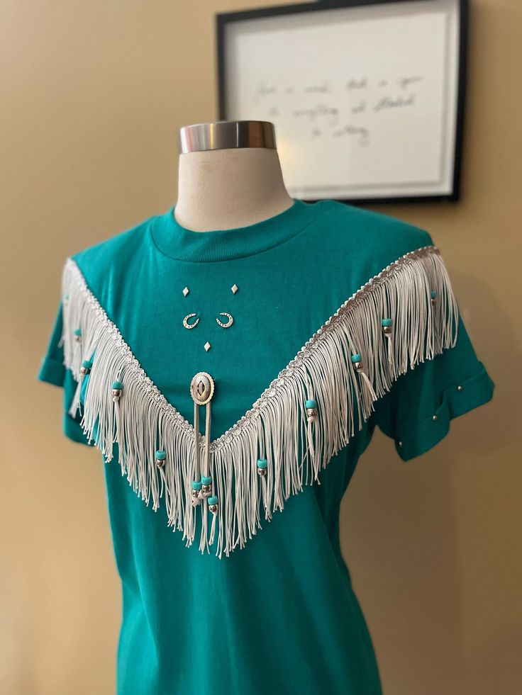 Vintage "Haywood Exclusive" western turquoise fringe shirt, in a women's size medium. Such a beautiful piece with beaded detailing, horse shoe garments and bolo. It does have shoulder pads- definitely from the early 90s late 80s. It's in amazing condition! Message me if you have any questions,. Fringe Blouse, Western Turquoise, Fringe Shirt, Late 80s, Palm Desert, Horse Shoe, Early 90s, Summer Sports, Shoulder Pads