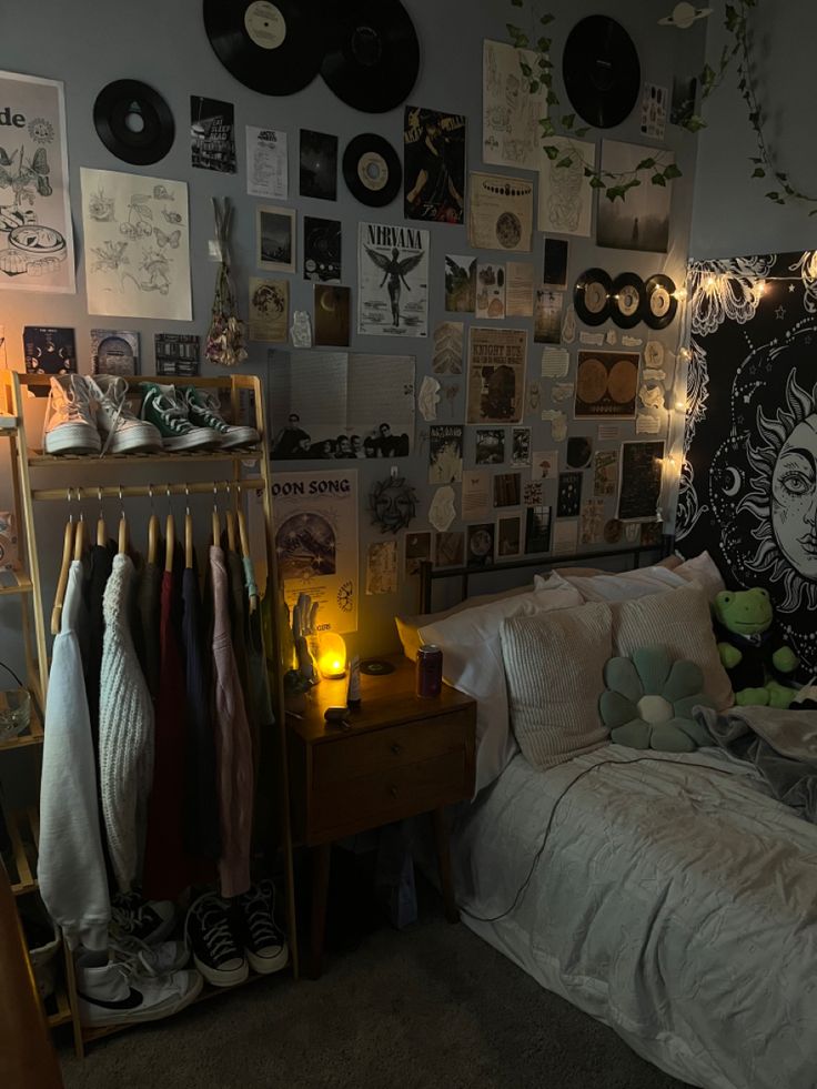 a bed room with a neatly made bed and lots of pictures on the wall