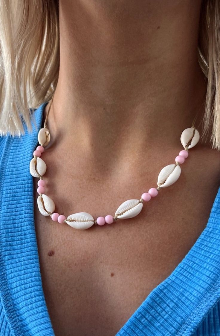 Description Dainty, Simplistic, Adorable for any occasion especially for the beach. Materials & Care Shells with string detail and Pink Beads Wipe as Needed Avoid liquids such as perfume and other chemicals Hand Measured Adjustable String for different fits Beachy Strand Jewelry For Beach Party, Beach Party Beachy Strand Jewelry, Strand Jewelry For Beach Party, Beachy Strand Jewelry For Vacation, Pink Round Beads Necklace For Vacation, Pink Round Bead Necklaces For Vacation, Pink Round Beads Necklaces For Vacation, Pink Jewelry For Beach Party, Bohemian Pink Jewelry For Beach Party