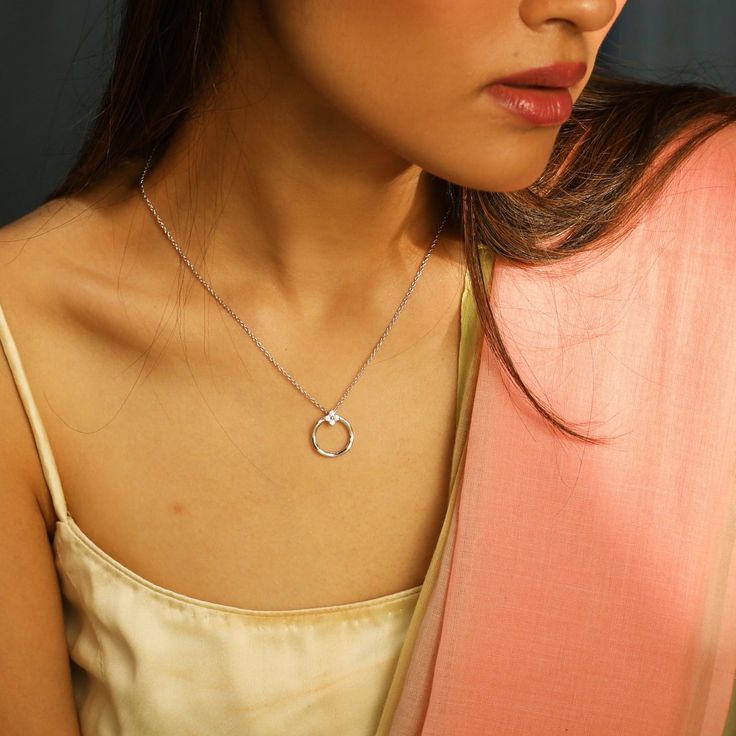 Description Tyarra is simple and classy just like you. This collection is crafted in hallmarked 925 silver with delicate patterns and high-quality CZ stones. Delicate CZ ring motif pendant suspended from a dainty adjustable chain, making this silver necklace perfect for those looking for a whimsical, minimalist style. Wear it alone or pair it with drop earrings for a chic look. Product Information Materials used: 925 Silver with 1.0-microns Rose, Gold & Rhodium Plating Stones: Semi precious ston Rose Gold Sterling Silver Charm Necklaces, Sterling Silver Open Circle Fine Jewelry, Simple Silver Diamond Jewelry, White Gold Sterling Silver Open Circle Jewelry, Delicate Round Pendant Jewelry, Elegant Silver Open Circle Necklace, Elegant Open Circle Silver Necklace, Minimalist Polished Cubic Zirconia Jewelry, Silver Diamond Charm Necklace With Delicate Chain