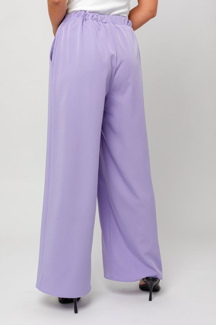 In a beautiful lavender color, these trousers feature a high-rise waistline, perfect for a sophisticated look. Model Info: Model is wearing a size small. True to size Height: 5'8" Bust: 32A Waist: 24" Hips: 34" Elegant Full-length Purple Bottoms, Elegant Full Length Purple Bottoms, Casual Lavender Wide Leg Bottoms, Elegant Purple Long Pants, Elegant High-waisted Purple Pants, Elegant Long Purple Pants, Lavender Full-length Fitted Bottoms, Trendy Lavender Wide Leg Pants, Elegant Wide Leg Purple Pants