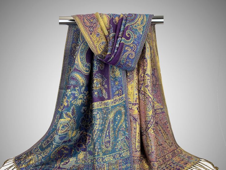 "Golden with purple and blue glitzy sparkling scarf for parties, weddings, proms, evening events and much more. Cotton reversible scarves for women with glittery shine all over. The beautiful shiny look make them fancy enough to be used as party / evening wear yet light weight enough to be used every day. Ideal rave pashmina. Great as bridal wrap, bridesmaids gift, beach cover up, sun screen or head cover. The options are endless. ~~Item details~~ Reversible sparkling silk pashmina scarf Size: 2 Festival Scarves, Pink Shawl, Bohemian Scarves, Chic Scarves, Reversible Scarf, Luxury Scarves, Bridal Wrap, Purple Teal, Pashmina Scarf