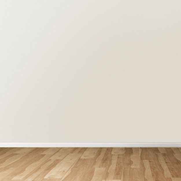 an empty room with white walls and wooden floors