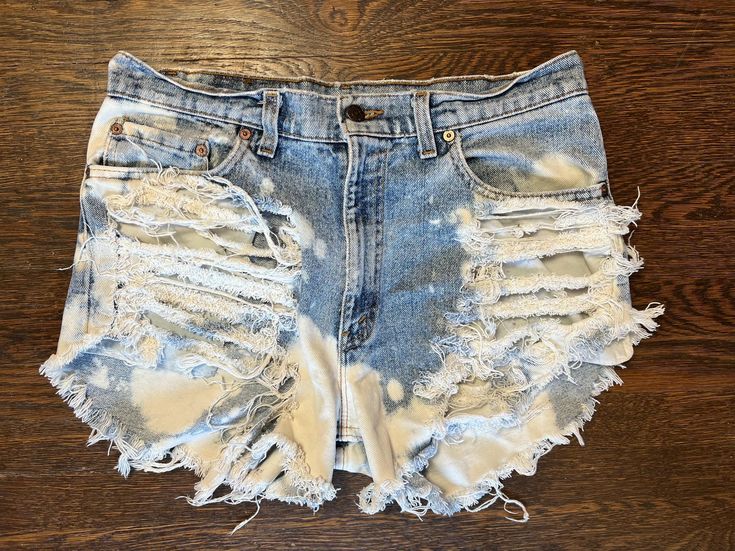 Vintage Levi's 550 Distressed & Bleached Jean Shorts - Size 33, 2-Inch Inseam These classic Levi's 550 jean shorts are the perfect blend of vintage style and edgy attitude! Expertly distressed with a unique bleached finish, these high-quality denim shorts are a standout addition to any wardrobe. Featuring a comfortable size 33 waist and a 2-inch inseam, they offer a flattering, relaxed fit that's great for everyday wear. *Size: 33 *Inseam: 2 inches *Fit: Relaxed, mid-rise *Style: Distressed and bleached for a one-of-a-kind look *Material: 100% durable cotton denim Perfect for summer festivals, casual outings, or a chic streetwear vibe, these Levi's shorts are both stylish and versatile. Pair them with your favorite tee or tank for an effortlessly cool look. Grab these unique vintage jean s Vintage Jean Shorts, Levis 550 Jeans, Bleached Jeans, Levis Denim Shorts, Levis 550, Jean Vintage, Cooler Look, Levis Denim, Blue Jean Shorts