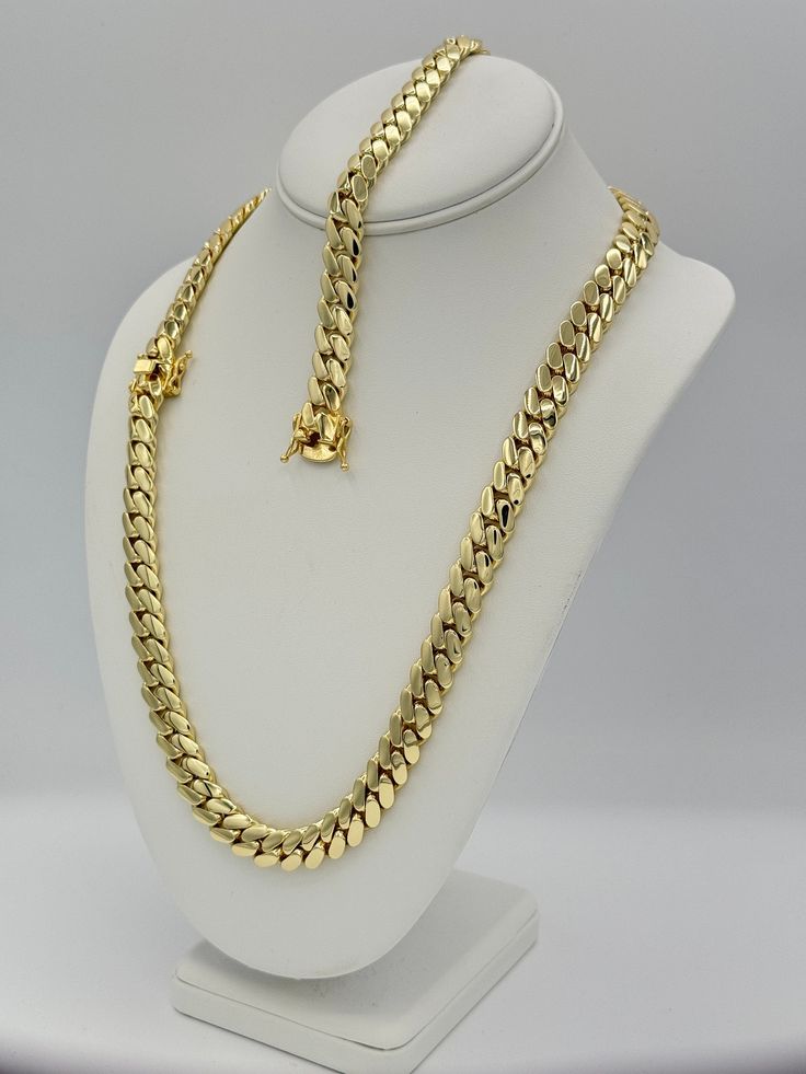 Cuban Link Chain Necklace Bracelet Set 14K Gold Plated 12MM Solid Indulge in the timeless elegance of our Cuban link chains and bracelets, meticulously handcrafted to perfection. Each piece is a solid statement of craftsmanship, created with passion and precision. Our Cuban link collection is plated not once, not twice, but five times with a lavish 14K Gold polish, ensuring a radiant and opulent finish that exudes sophistication. Embrace the uniqueness of handmade jewelry, where each link is car 14k Gold Chain Jewelry For Anniversary, 14k Gold Link Jewelry For Anniversary, 14k White Gold Jewelry With Curb Chain, Yellow Gold Plated Jewelry With Curb Chain, Gold-plated Yellow Gold Jewelry With Curb Chain, White Gold Cuban Link Chain Jewelry, Classic Gold Cuban Link Jewelry, Classic Gold Curb Chain Jewelry, Gold Cuban Link Curb Chain Jewelry