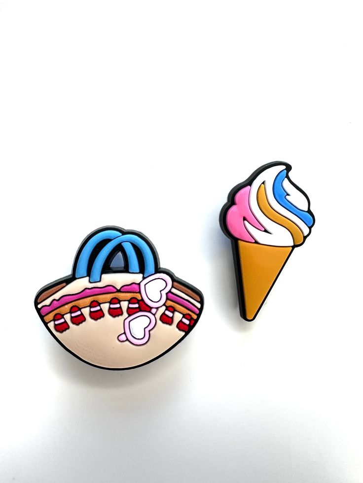 two pin badges depicting ice cream, an ice cream cone and a sundae on white background