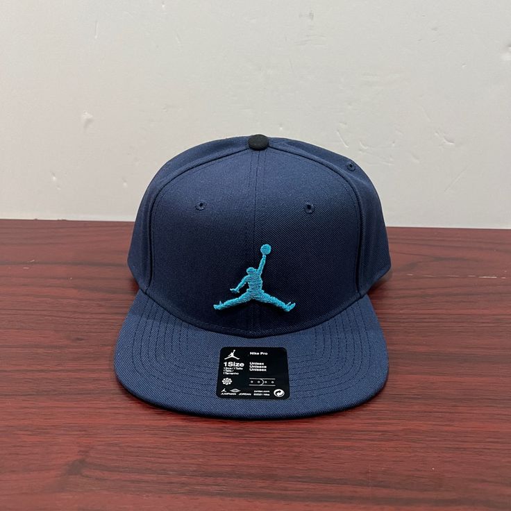 Brand - Jordan Hat Model - Nike Pro Color - Blue Style Code - Ar2118-410 Condition- Brand New Age - Adult Gender - Unisex Adjustable Navy Snapback Hat, Navy Adjustable Fitted Cap, Casual Navy Adjustable Snapback Hat, Navy Flat Brim Baseball Cap, One Size, Adjustable Navy Hat With Flat Bill, Adjustable Navy Flat Bill Hats, Navy Snapback Hat With Flat Brim, Navy Adjustable Snapback Hat With Flat Bill, Navy Adjustable Baseball Cap With Flat Brim